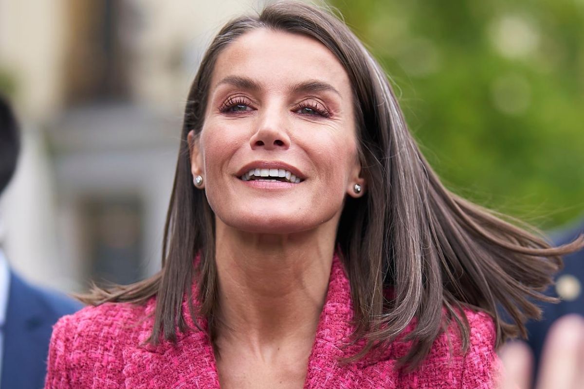 Queen Letizia makes a gesture of pain caused by the injury to her right foot