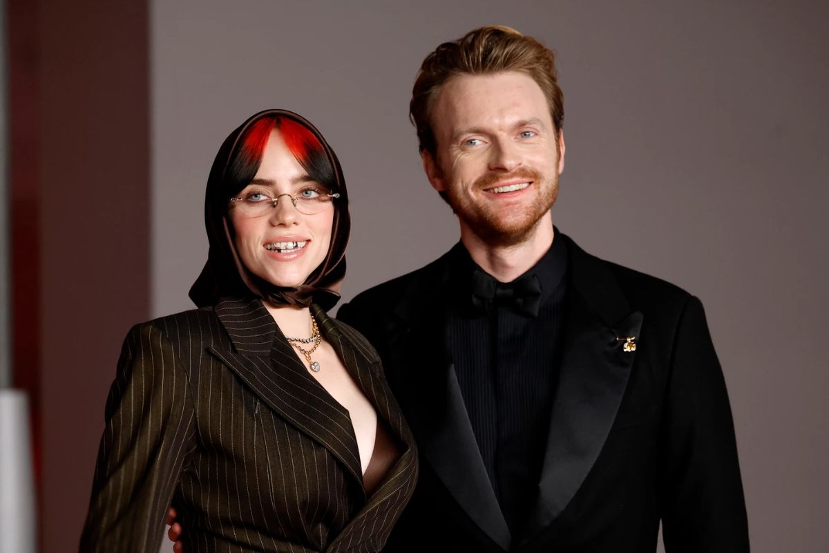 Finneas defends sister Billie Eilish after her 'Guess' verse is accused of being predatory